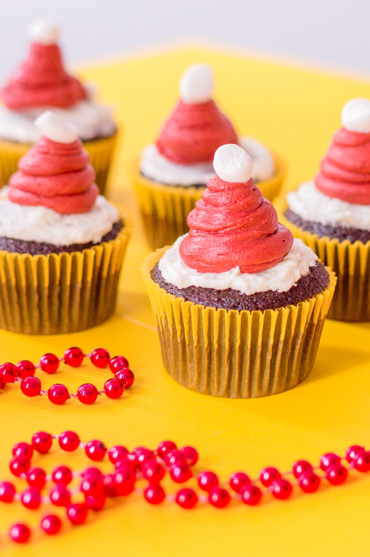 chocolate cupcake with red frosting hat