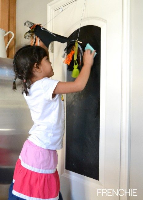 Use a chalkboard door to create and art center for kids on seelindsay.com