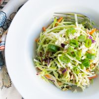 This amazing Broccoli Slaw Salad with crunchy ramen noodles is a must-have at your next barbeque. Create this easy salad in less than 10 minutes and you have a recipe that will stand the test of time. #summersalad #broccolislawsalad #broccolislawsaladrecipe #bbqsalad #sidesalad #potlucksalad