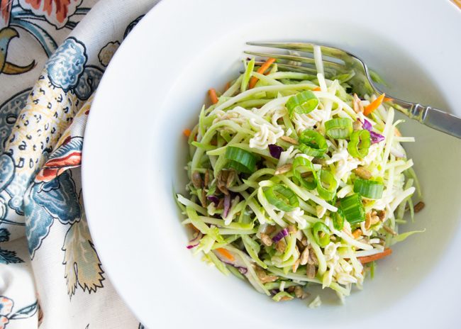 This amazing Broccoli Slaw Salad with crunchy ramen noodles is a must-have at your next barbeque. Create this easy salad in less than 10 minutes and you have a recipe that will stand the test of time. #summersalad #broccolislawsalad #broccolislawsaladrecipe #bbqsalad #sidesalad #potlucksalad