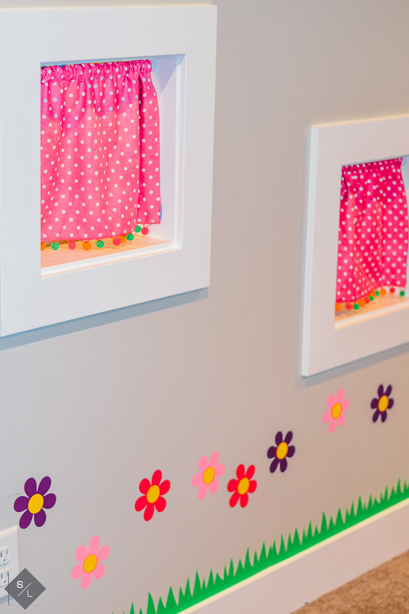 Indoor playroom under the stairs with indoor flower garden made with vinyl