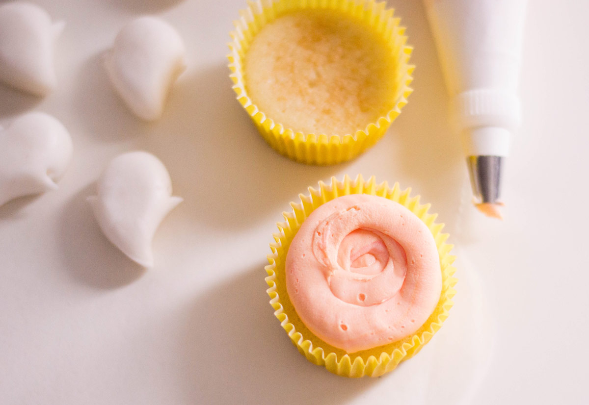 frosting a cupcake