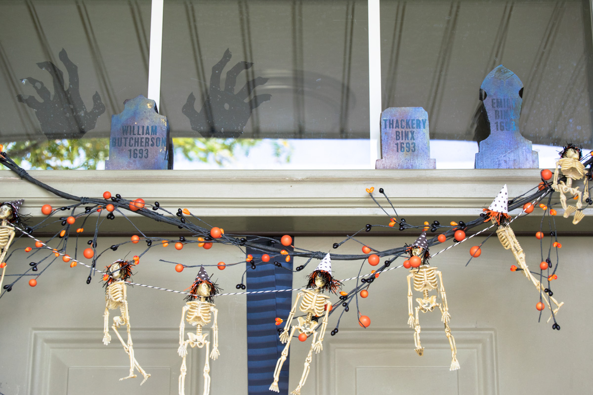 hocus pocus tombstone with skeleton garland