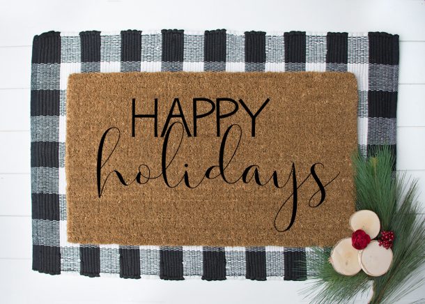 DIY doormat for Christmas that says Happy Holidays