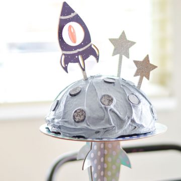 spaceship cricut cake topper on moon cake