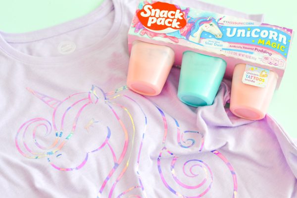 Make the coolest unicorn shirt using this free unicorn SVG file that can be cut on your Silhouette or Cricut machine. Use your Cricut EasyPress to adhere the holographic HTV and enjoy your unicorn Snack Packs as you rock your awesome unicorn shirt. #unicornsvg #unicornshirt #cricutmade #silhouettecameo #freesvgfile #unicorncraft #kidsshirt #diytshirt