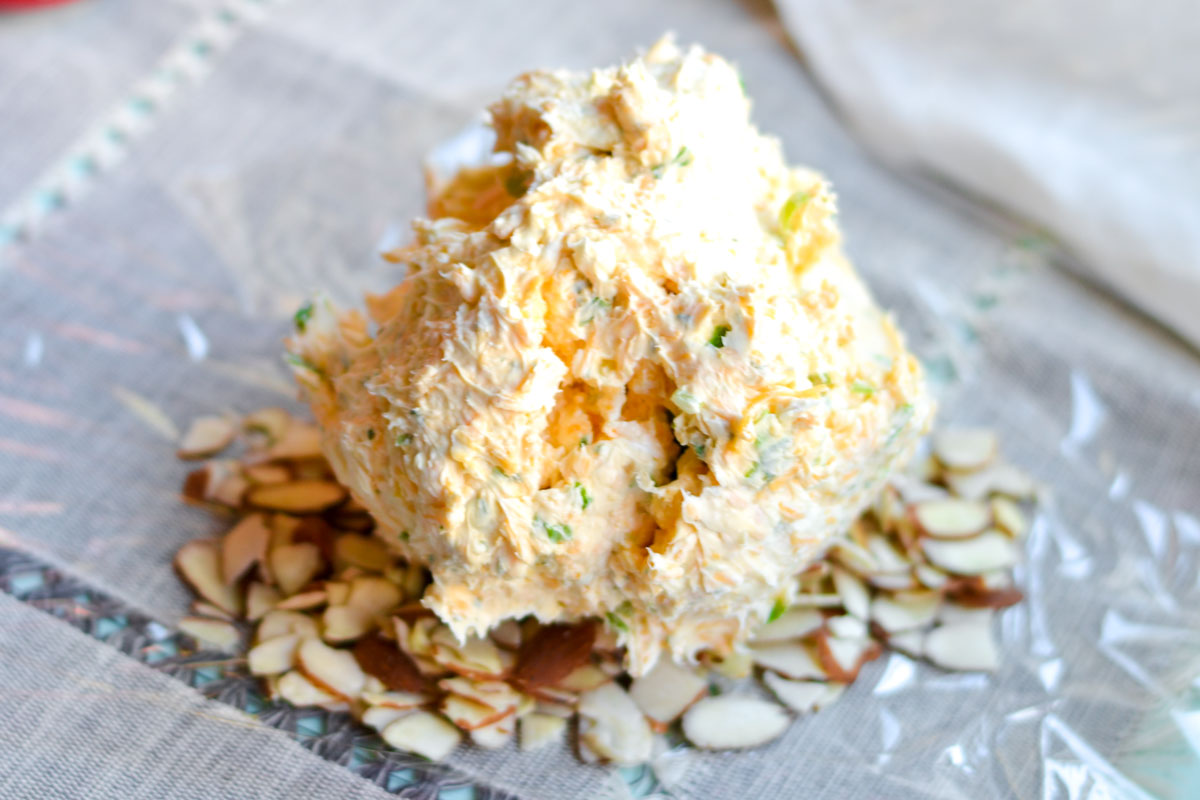 covering a cheese ball in almonds