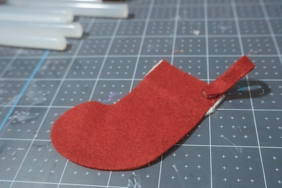 glueing tab on felt stocking