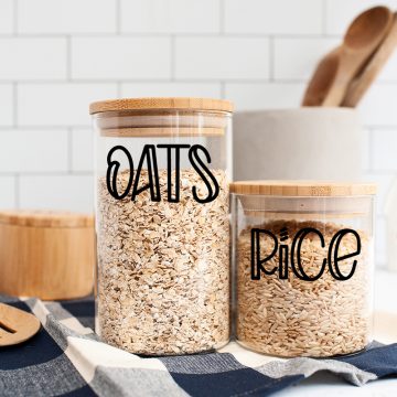 jars on counter filled with oats and rice with labels